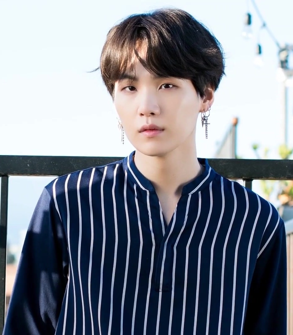 Suga at the BTS fifth anniversary photoshoot in 2018